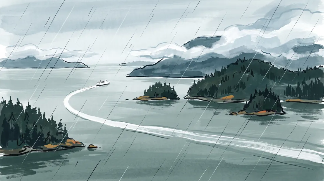 Ferry wake between forested islets in light rain